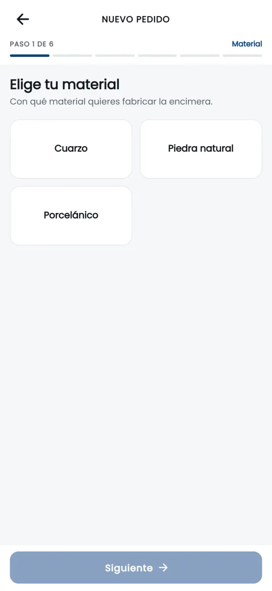 Paso 1 de 6 del configurador: elegir material entre cuarzo, piedra natural y porcelánico.